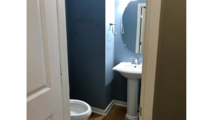 Bathroom with pedestal sink and toilet