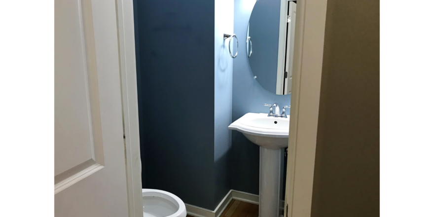 Bathroom with pedestal sink and toilet