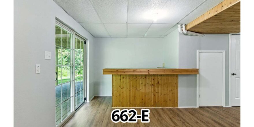 an empty room with a bar in the middle