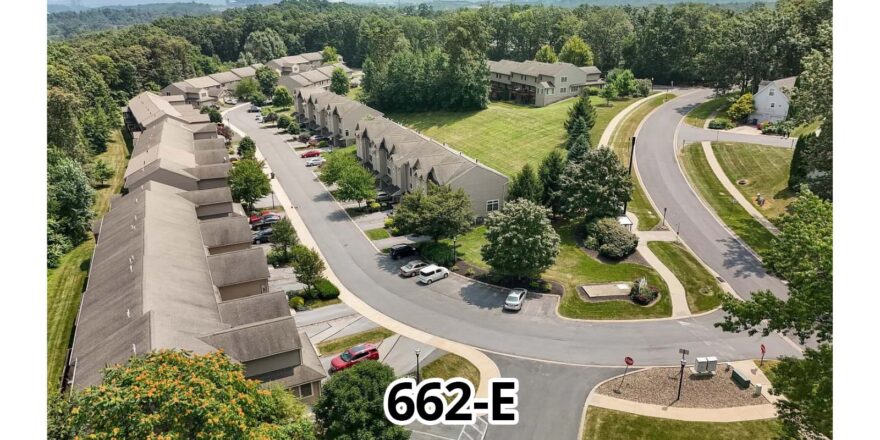 an aerial view of a street and parking lot