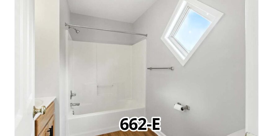 a bathroom with a skylight above the toilet