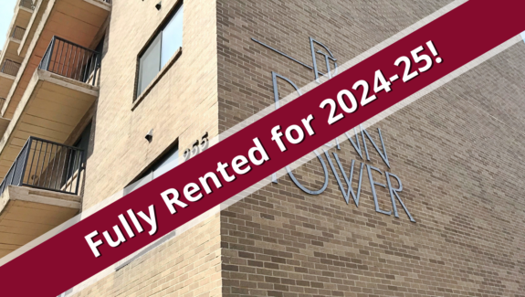 exterior of Penn Tower with a red banner stating property is fully rented for 2024-2025