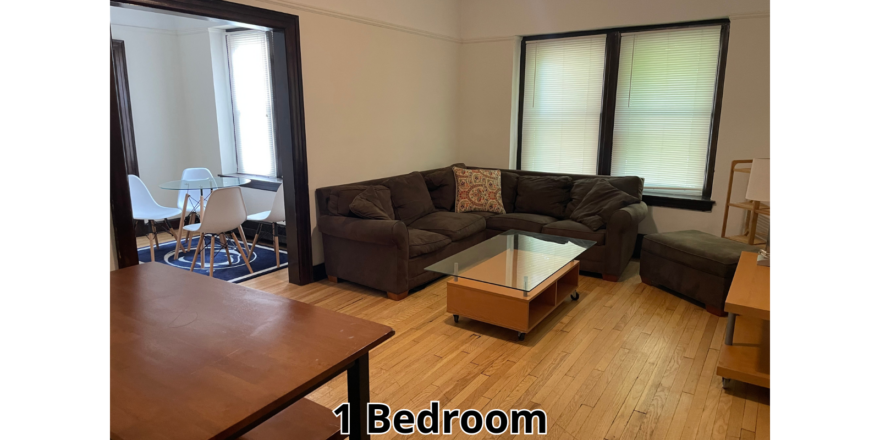 a living room filled with furniture and a wooden table