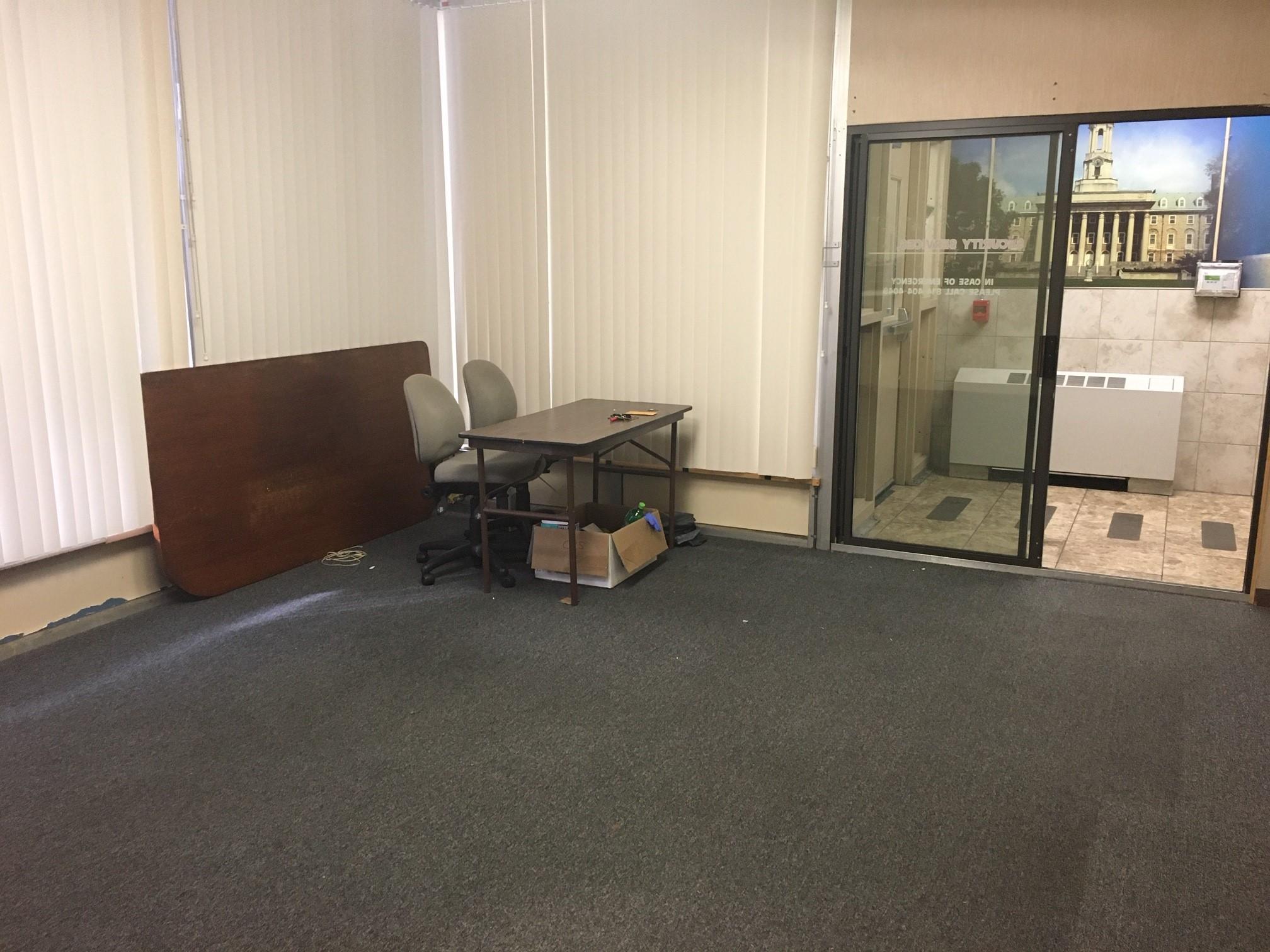 Empty office with desk and chairs