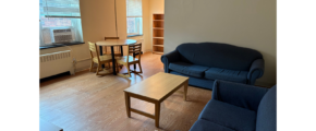 a living room filled with furniture and a table