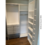 an empty closet with white shelves and drawers