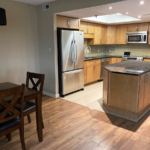 a kitchen with a center island in the middle of it