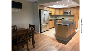 a kitchen with a center island in the middle of it