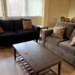 a living room with two couches and a coffee table