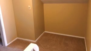 Carpeted attic alcove between two flex rooms