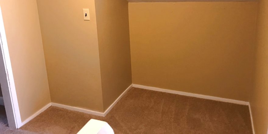 Carpeted attic alcove between two flex rooms