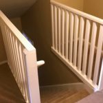 Carpeted stairwell from the top of the steps