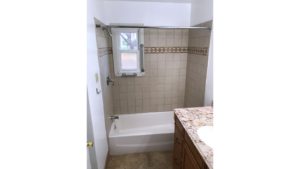 Bathroom with tub/shower combo and vanity