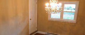 Dining room with chandelier and doorway to attic flex space