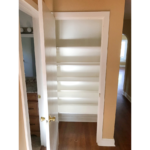 Hallway closet with built-in shelving