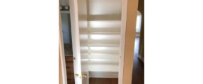 Hallway closet with built-in shelving