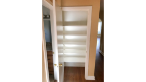 Hallway closet with built-in shelving