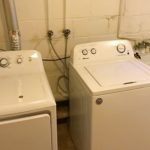 Laundry room with washer, dryer, and laundry tub