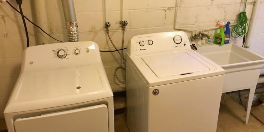 Laundry room with washer, dryer, and laundry tub