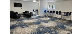 a large room with chairs and a flat screen tv