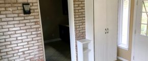 Tiled mudroom with storage cabinet