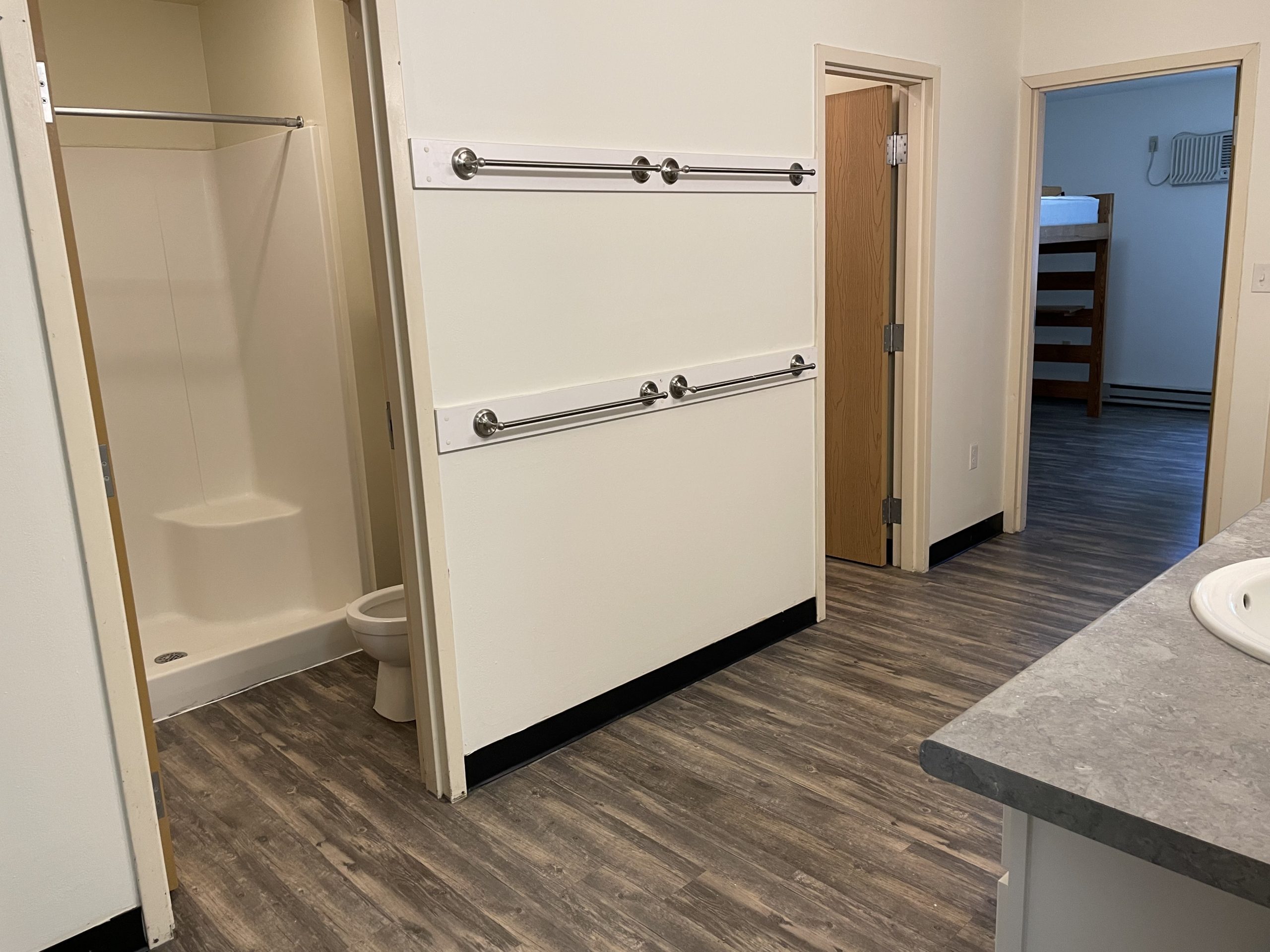 Bathroom with shower, toilet, and vanity