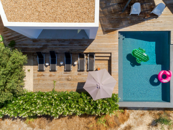 an aerial view of a house with a swimming pool