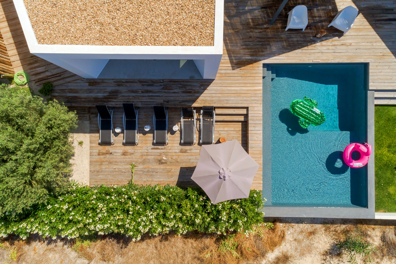 an aerial view of a house with a swimming pool