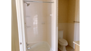 Bathroom with shower stall and toilet