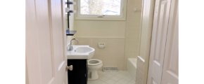 Bathroom with vanity, toilet, and tub/shower combo