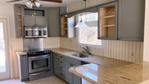 Kitchen with since, ceiling fan, cabinets, and stainless steel appliances