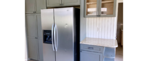 Kitchen with cabinets and stainless steel fridge