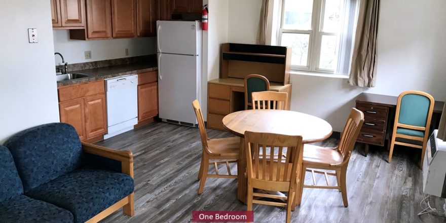 Living Room and Kitchen with wooden furniture, white appliances, and wood-tone cabinets