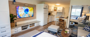 a living room filled with furniture and a flat screen tv