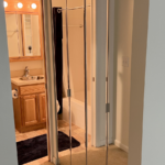 a bathroom with a sink and mirror in it