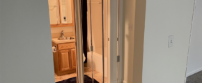 a bathroom with a sink and mirror in it