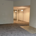 an empty room with white walls