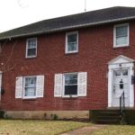 Exterior of brick duplex at 1140-1144 S Atherton Street