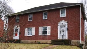 Exterior of brick duplex at 1140-1144 S Atherton Street