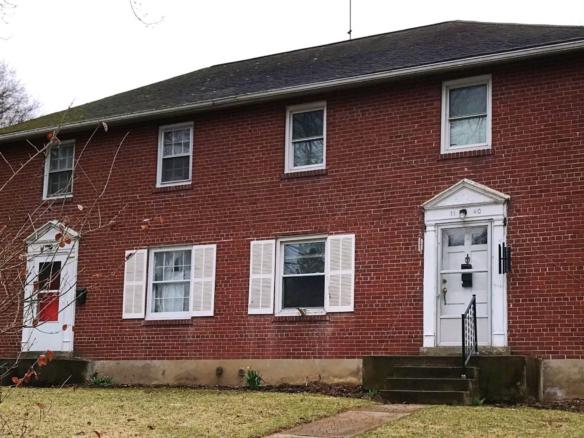 Exterior of brick duplex at 1140-1144 S Atherton Street