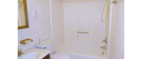 Bathroom with vanity, medicine cabinet, toilet, and shower and tub combo