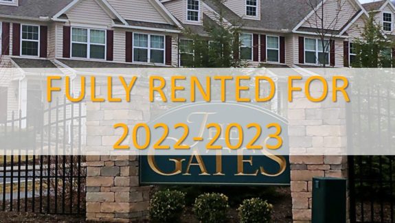 Sign at The Gates with a label that shows the property is fully rented for 2022-2023