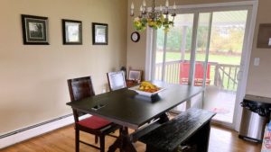 Dining room with slider and dining table and chairs