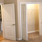 Unfurnished, carpeted bedroom with closet