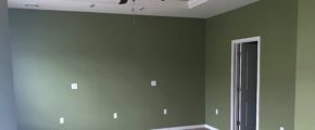 Unfurnished, carpeted owner's suite bedroom with ceiling fan