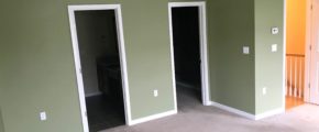 Unfurnished, carpeted owner's suite bedroom viewing into en suite bathroom and walk in closet