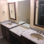 En suite bathroom with duel vanity and walk in shower with rain shower head