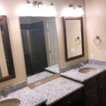 En suite bathroom with duel vanity and walk in shower with rain shower head