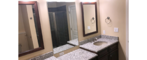 En suite bathroom with duel vanity and walk in shower with rain shower head