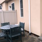 Fenced-in patio with furniture